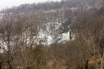 Beautiful frozen waterfall in the mountains.