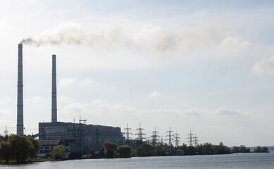 Obraz premium Panoramic view of power station Lukomlskaya Gres. Chimneys with smoke of power plant. Ecological problem. Environmental pollution concept.