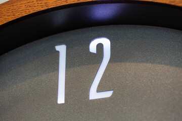 Closeup shot of number 12 on a clock