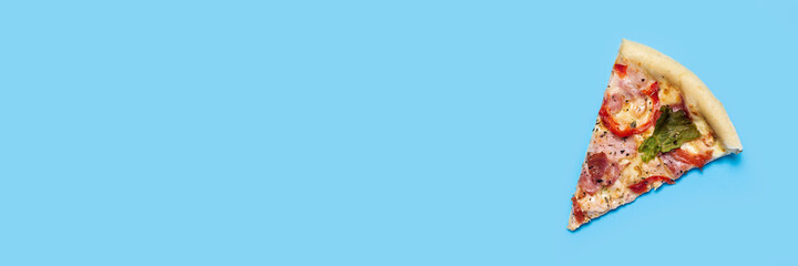 slice of hot fresh pizza lies on a blue background. Top view, flat lay. Banner