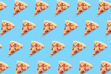 background of slices of hot fresh pizza on a blue background. Top view, flat lay