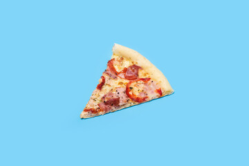 slice of hot fresh pizza lies on a blue background. Top view, flat lay