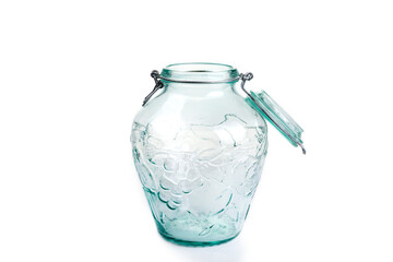 The clear empty jar with a lid on a white
