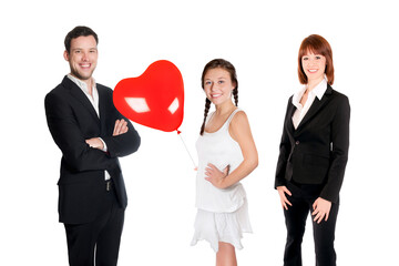 Group portrait of a happy young family of three, isolated in front of white studio background