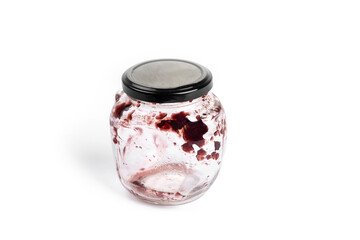 Empty jam jar on a white background