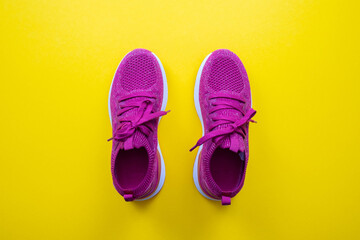 jogging - pink sneakers on a yellow background