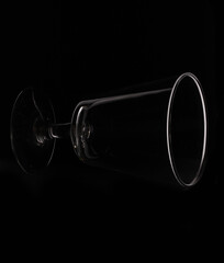 wine glass as idea and concept lighting and black background.