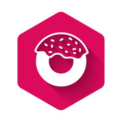 White Donut with sweet glaze icon isolated with long shadow background. Pink hexagon button. Vector