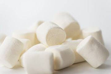 Marshmallows on a light background. Selective focus.