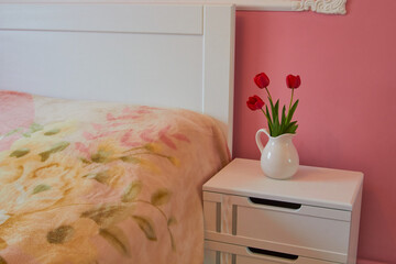white bed with flowers,bedroom with white bed and flowers tulips