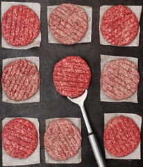 Uncooked Ground Beef Patties for Grilling. Raw Minced Steak Burgers from Beef and Pork Meat on...
