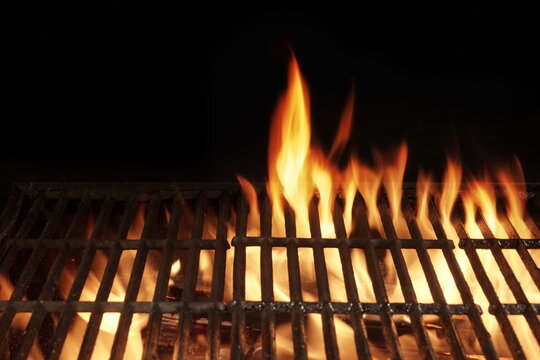 Empty Flaming BBQ Charcoal Grill, Closeup. Hot Barbeque Grill Ready Cooking Food On Cast Iron Grate. Concept For Cookout, Barbecue Party At Garden Or Backyard. Grill With Bright Flames Black Isolated.