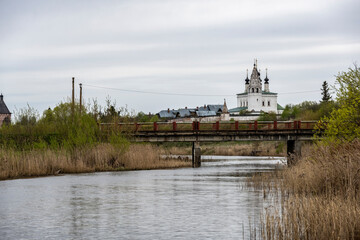 monasteries and fortresses of old Suzdal against the backdrop of a green river