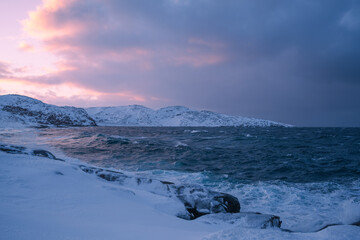 Cloudy weather conditions in the Arctic region, natural scenery along the Arctic Ocean. Winter nature background picture.