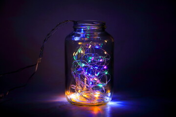 Colorful Fairy Light in a Glass Jar, in the Dark, Low-Key Photography