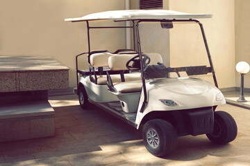 Electrical Hotel Or Resort Service Car Closeup. Golf Car Close Up. Long Electric Shuttle Passenger Bus.
