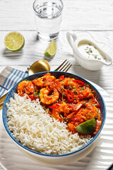 Tomato prawn curry with jasmine rice, top view