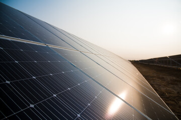 Blue solar panels with the sunny sky