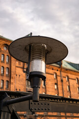 a close-up of a streetlight in the harbor of hamburg, respectively the speicherstadt, photographed during daytime