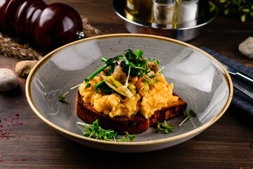 Breakfast omelette with champignon on wooden background