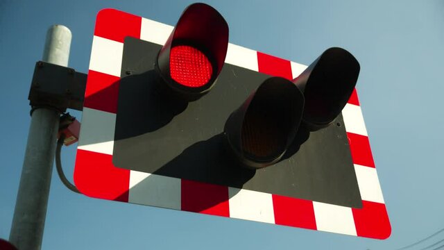 level crossing lights warn of train approaching