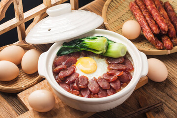 Cantonese style cooking of claypot rice with waxed meats