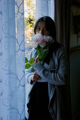 Young Woman Holding Flowers
