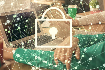 Double exposure of man and woman working together and technology theme lock drawing hologram. Security concept. Computer background.