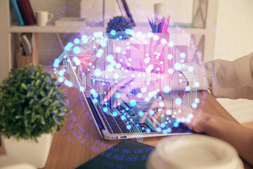Double exposure of woman hands working on computer and brain hologram drawing. Ai concept.