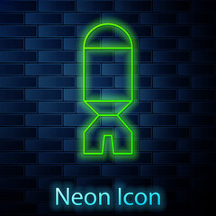 Glowing neon line Rocket launcher with missile icon isolated on brick wall background. Vector