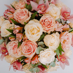 Round royal blue velvet box with white roses and pink alstroemeria and cymbidium.