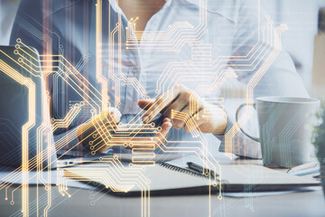 Double exposure of tech icon hologram and woman holding and using a mobile device. Technology concept.