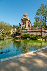 Fototapeta na wymiar Picture of the famous castle with fountains of Ciutadella Park in Barcelona taked in a sunny day.