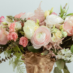 Flower statuette composed of minirosa, ranunculus, eustoma, matiola, astilbe, roses and eucalyptus.