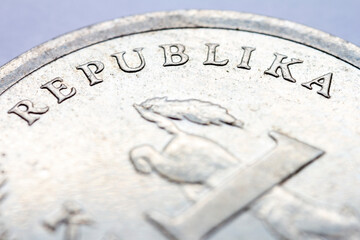 A fragment of croatian metal coin macro photo