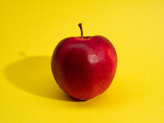 red apples on yellow background