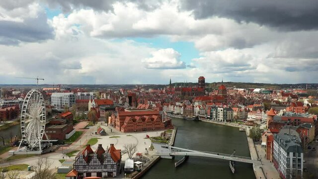 Old town of Gdansk reflected in the Motlawa river at spring, Poland.