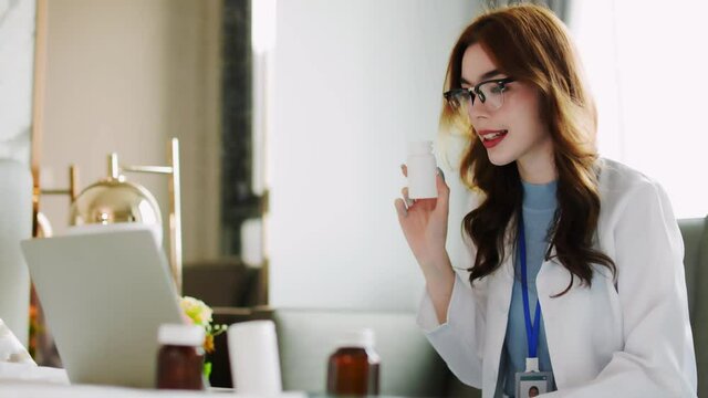 Woman doctor visit,telemedicine healthcare concept,young female doctor giving advice over laptop computer .she using laptop to get medical consultation online and explane .