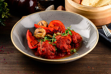 Meatballs with vegetables close-up on the table