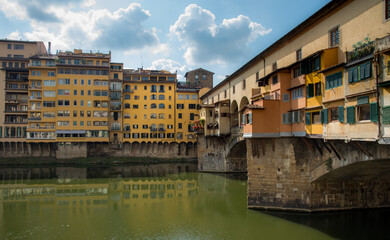 Fototapeta na wymiar Ponte Vecchio landmark reflected on arno river. Florence, Tuscany Italy.