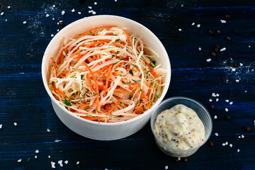 Bowl of coleslaw with shredded cabbage