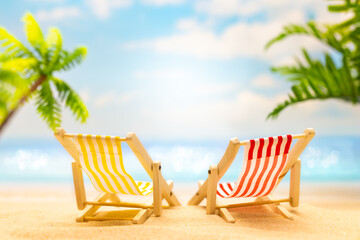  Summer relax concept. Sunny tropical beach with sun lounger and palm tree. Summer Holidays...