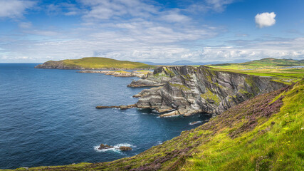 Large panorama with Kerry Cliffs and blue coloured Atlantic Ocean on a sunny summer day, Portmagee,...