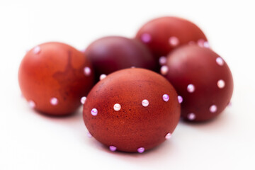 5 brown chicken eggs with white beads