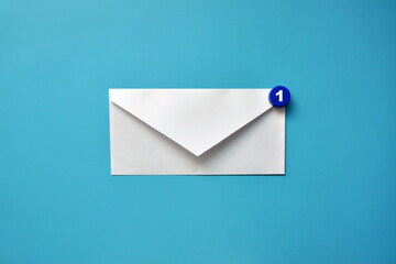 A paper letter and the number one on it. Symbol of correspondence and messaging between people

