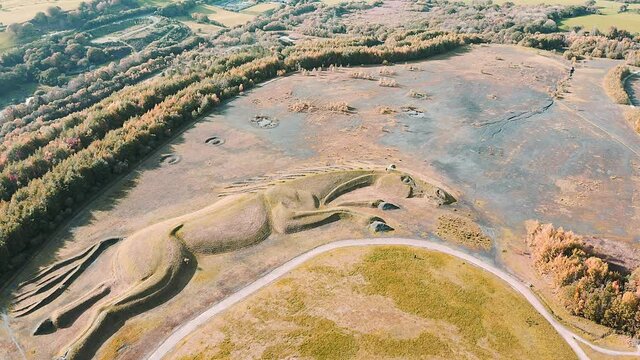 4k aerial view shape of a pit pony on top of a closed, reclaimed coal mine Penallta, Wales