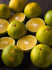 Fresh Mousambi OR Green lemon stock image on dark background.