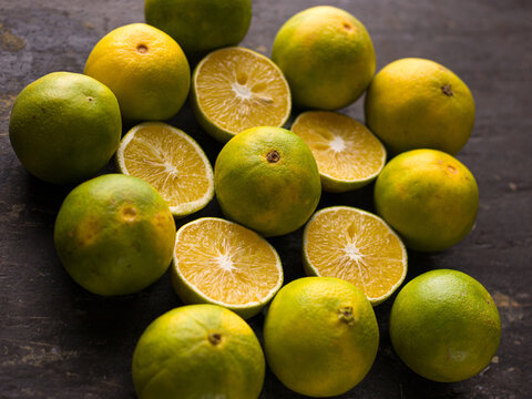 Fresh Mousambi OR Green lemon stock image on dark background.