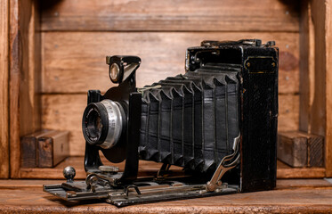 old photo camera wooden baground