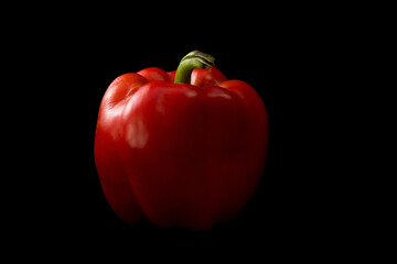 Fresh red bell pepper isolated on black background - Healty food